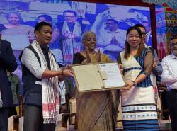 Hon'ble Finance Minister hands over sanction letters from banks to beneficiaries under various Central Government schemes during the Credit Outreach Programme in Itanagar, Arunachal Pradesh in presence of Hon'ble Chief Minister Shri Pema Khandu.