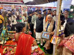 Hon'ble Finance Minister Smt. Nirmala Sitharaman along with Shri Samrat Choudhary, Hon'ble Deputy Chief Minister of Bihar, and Shri Sanjay Kumar Jha, Hon'ble MP (RS), visit the stalls and interacts with the stall owners who have benefited from various schemes of the central and state govt during the Credit Outreach Programme in Madhubani, Bihar.