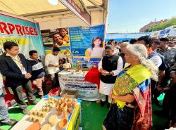 Hon'ble Finance Minister Smt. Nirmala Sitharaman along with Shri Samrat Choudhary, Hon'ble Deputy Chief Minister of Bihar, and Shri Sanjay Kumar Jha, Hon'ble MP (RS), visit the stalls and interacts with the stall owners who have benefited from various schemes of the central and state govt during the Credit Outreach Programme in Madhubani, Bihar.